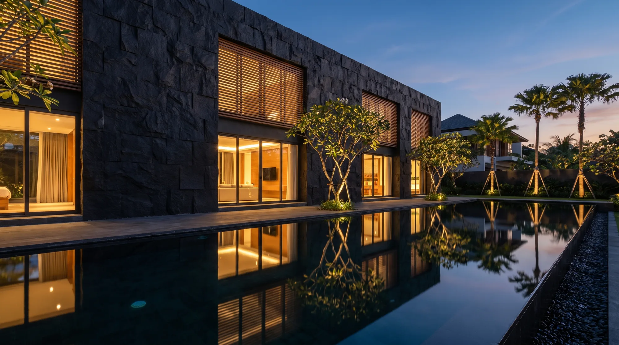 Villa facade clad in flexible ceramic travertine panels at golden hour